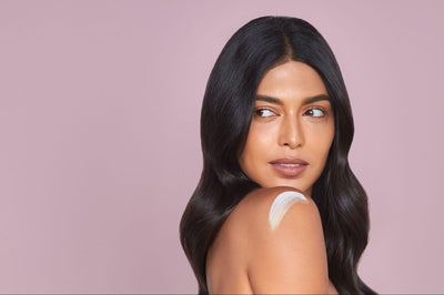 Model using beauty base on shoulder